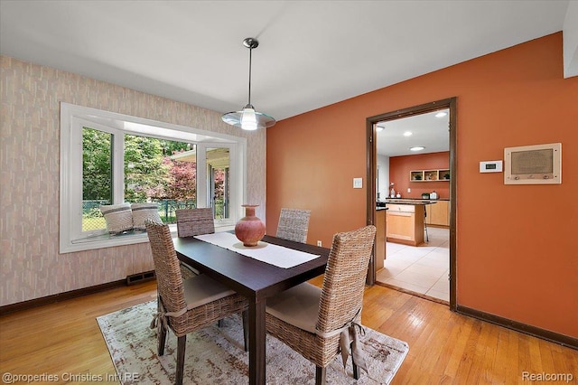 30700 Marimoor St, Beverly Hills, MI 48025 - dining room featuring an accent wall, wallpapered walls, and light wood-style flooring