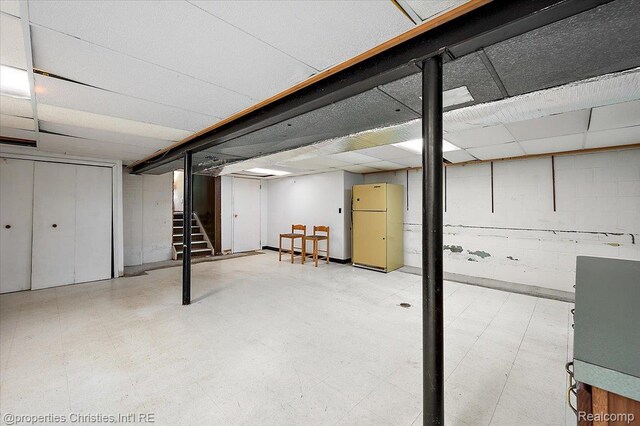 30700 Marimoor St, Beverly Hills, MI 48025 - finished below grade area with freestanding refrigerator, tile patterned floors, and stairs