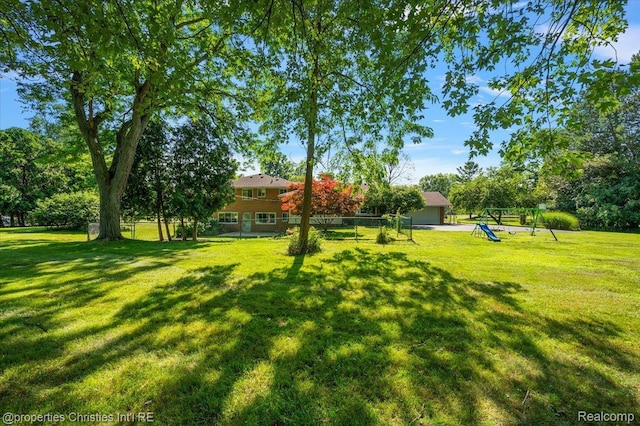 30700 Marimoor St, Beverly Hills, MI 48025 - view of green lawn featuring a playground