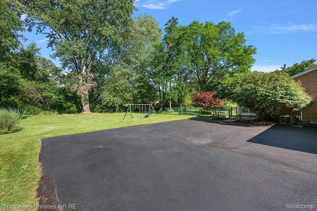 30700 Marimoor St, Beverly Hills, MI 48025 - view of yard with a playground and driveway