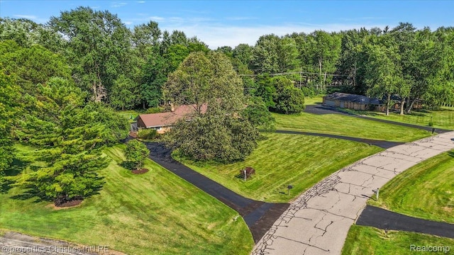 30700 Marimoor St, Beverly Hills, MI 48025 - drone / aerial view of a heavily wooded area