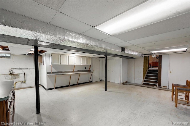 30700 Marimoor St, Beverly Hills, MI 48025 - finished basement with a drop ceiling, light flooring, and stairway