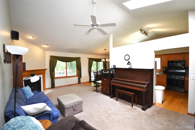 10010 Orchard Ridge Ct, Holly, MI 48442 - living room with lofted ceiling, light colored carpet, a chandelier, a fireplace with flush hearth, and ceiling fan