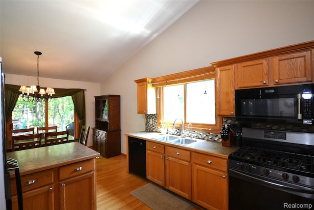 10010 Orchard Ridge Ct, Holly, MI 48442 - kitchen featuring black appliances, vaulted ceiling, a chandelier, backsplash, and light wood finished floors
