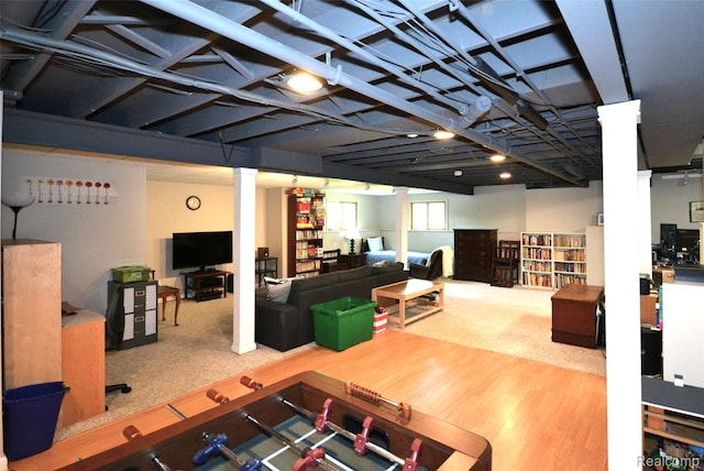 10010 Orchard Ridge Ct, Holly, MI 48442 - living area featuring carpet, decorative columns, and wood finished floors