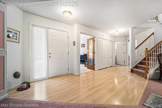 648SHADYMAPLE Shady Maple Dr Unit 16, Wixom, MI 48393 - foyer with wood finished floors and stairway