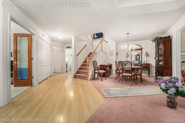 648SHADYMAPLE Shady Maple Dr Unit 16, Wixom, MI 48393 - foyer with stairs, light wood-type flooring, and a chandelier