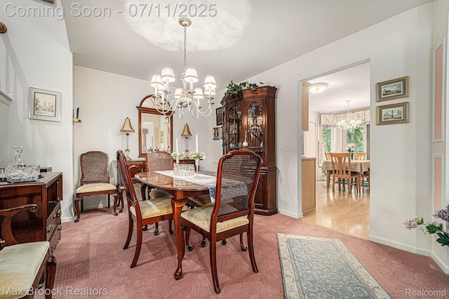 648SHADYMAPLE Shady Maple Dr Unit 16, Wixom, MI 48393 - dining area featuring a chandelier and light carpet