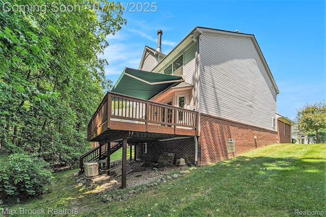 648SHADYMAPLE Shady Maple Dr Unit 16, Wixom, MI 48393 - rear view of property with a lawn, a deck, stairway, and brick siding