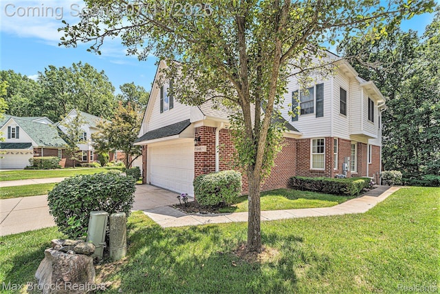 648SHADYMAPLE Shady Maple Dr Unit 16, Wixom, MI 48393 - view of front of house featuring brick siding, a garage, a front yard, and driveway
