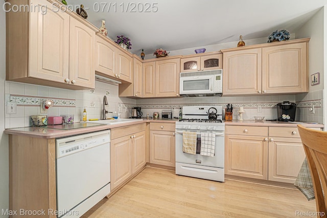 648SHADYMAPLE Shady Maple Dr Unit 16, Wixom, MI 48393 - kitchen featuring white appliances, light brown cabinetry, and tasteful backsplash