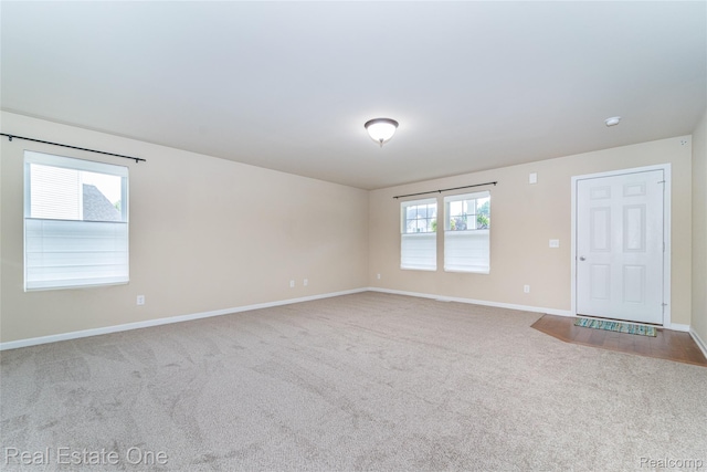 750 Dewars St, Howell, MI 48843 - spare room featuring carpet flooring and baseboards