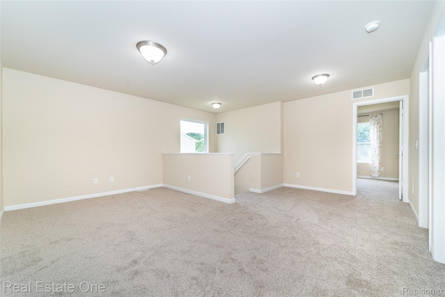 750 Dewars St, Howell, MI 48843 - spare room featuring light carpet and a smoke detector