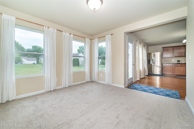 750 Dewars St, Howell, MI 48843 - carpeted empty room with baseboards