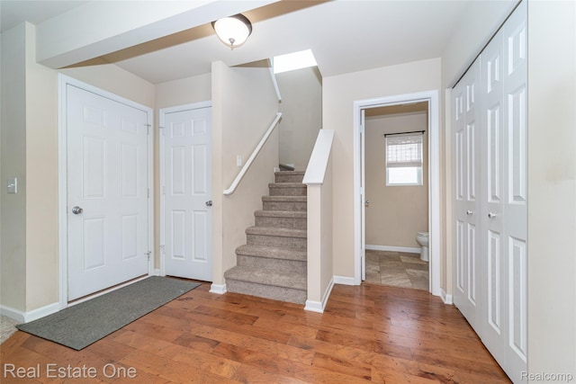 750 Dewars St, Howell, MI 48843 - entrance foyer featuring hardwood / wood-style flooring and stairs