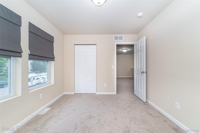 750 Dewars St, Howell, MI 48843 - unfurnished bedroom featuring carpet floors and a closet