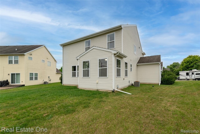 750 Dewars St, Howell, MI 48843 - back of house with a lawn