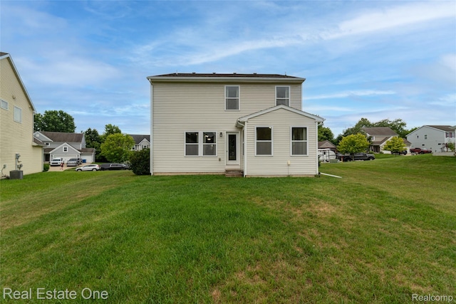 750 Dewars St, Howell, MI 48843 - rear view of house featuring a yard and entry steps