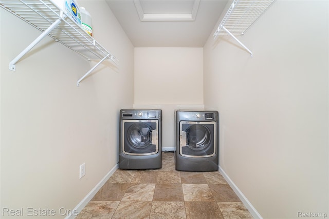 750 Dewars St, Howell, MI 48843 - washroom featuring separate washer and dryer and stone finish floors