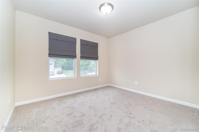 750 Dewars St, Howell, MI 48843 - carpeted spare room featuring baseboards