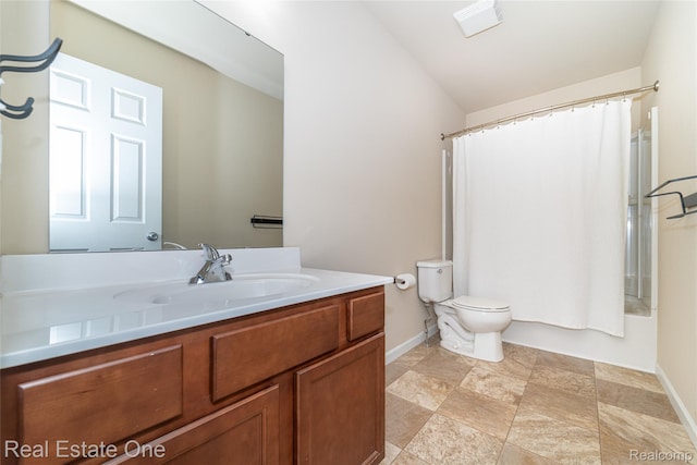 750 Dewars St, Howell, MI 48843 - full bathroom featuring vanity, shower / bath combo with shower curtain, and stone finish flooring