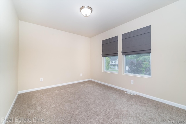750 Dewars St, Howell, MI 48843 - carpeted spare room with baseboards