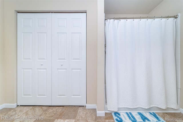 750 Dewars St, Howell, MI 48843 - full bath with baseboards and shower / bath combination with curtain