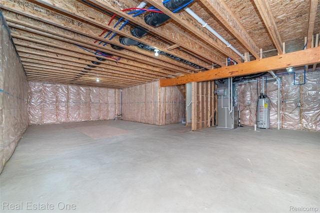 750 Dewars St, Howell, MI 48843 - unfinished below grade area with heating unit and water heater