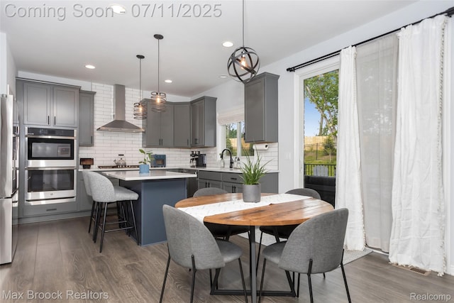 460 Lake Manitou Trl, Oxford, MI 48371 - dining area with dark wood-style flooring and recessed lighting