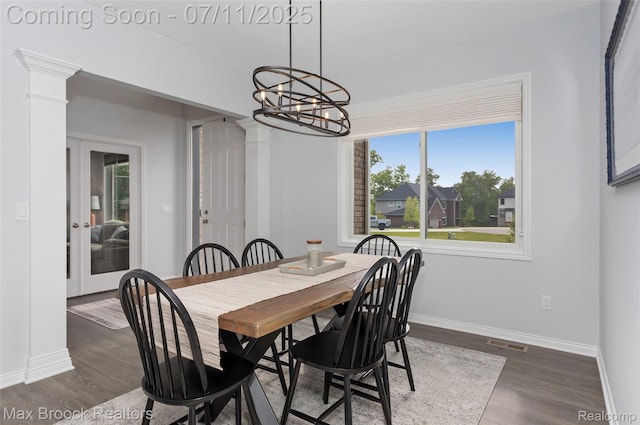460 Lake Manitou Trl, Oxford, MI 48371 - dining room with ornate columns, dark wood-style flooring, a chandelier, and french doors
