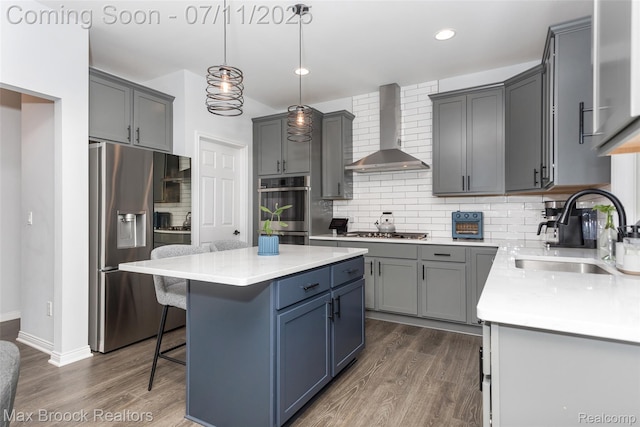 460 Lake Manitou Trl, Oxford, MI 48371 - kitchen with wall chimney exhaust hood, stainless steel appliances, dark wood-style floors, a center island, and recessed lighting