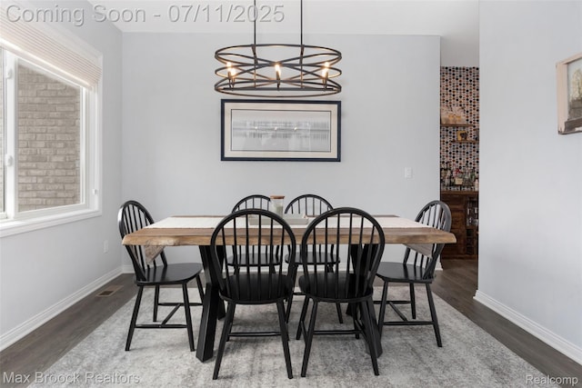 460 Lake Manitou Trl, Oxford, MI 48371 - dining area with wood finished floors, a chandelier, and plenty of natural light