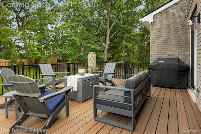 460 Lake Manitou Trl, Oxford, MI 48371 - wooden terrace featuring area for grilling and an outdoor hangout area