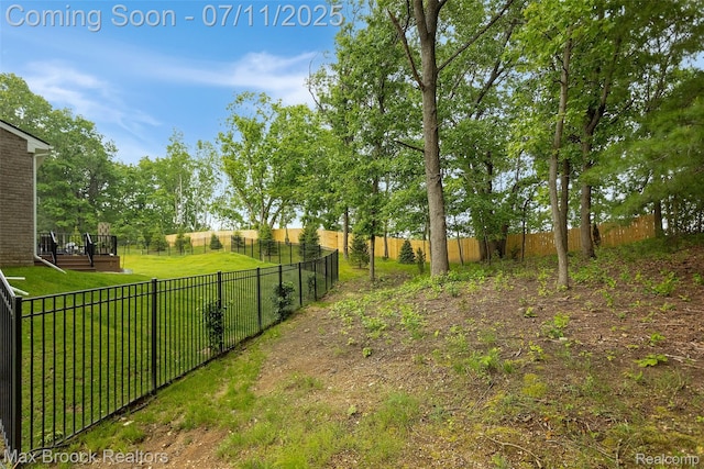 460 Lake Manitou Trl, Oxford, MI 48371 - fenced backyard featuring a wooden deck