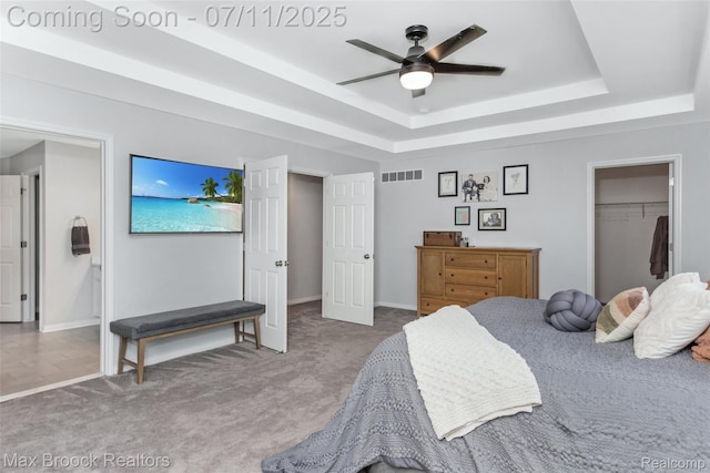 460 Lake Manitou Trl, Oxford, MI 48371 - bedroom with a raised ceiling, carpet, a closet, ceiling fan, and a walk in closet