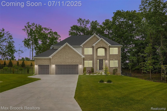 460 Lake Manitou Trl, Oxford, MI 48371 - traditional-style house with driveway, brick siding, and a garage