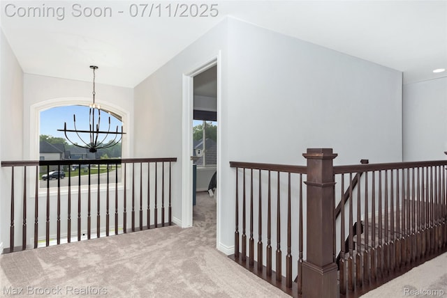 460 Lake Manitou Trl, Oxford, MI 48371 - hallway featuring a chandelier, an upstairs landing, and carpet floors