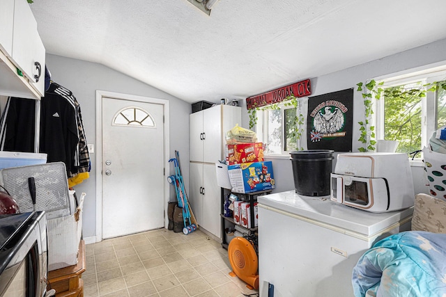 1638 Cherry St, Niles, MI 49120 - kitchen with lofted ceiling, a textured ceiling, and white cabinets
