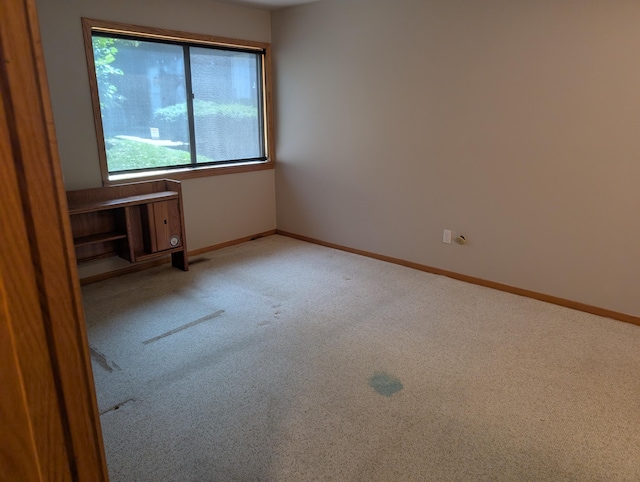 149 Selkirk Ct Unit A, Kalamazoo, MI 49006 - carpeted empty room featuring baseboards