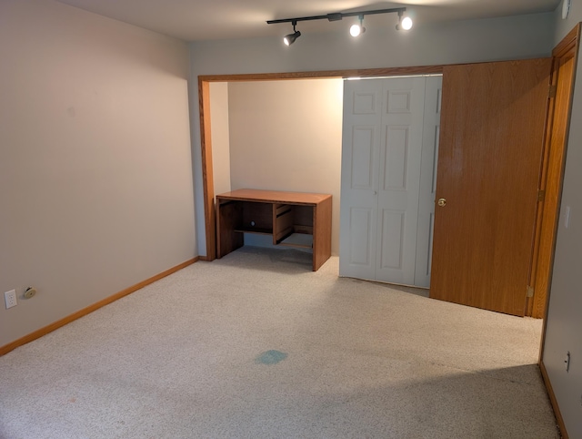 149 Selkirk Ct Unit A, Kalamazoo, MI 49006 - unfurnished bedroom featuring light colored carpet and rail lighting