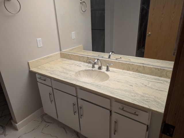 149 Selkirk Ct Unit A, Kalamazoo, MI 49006 - bathroom featuring vanity and marble finish floors