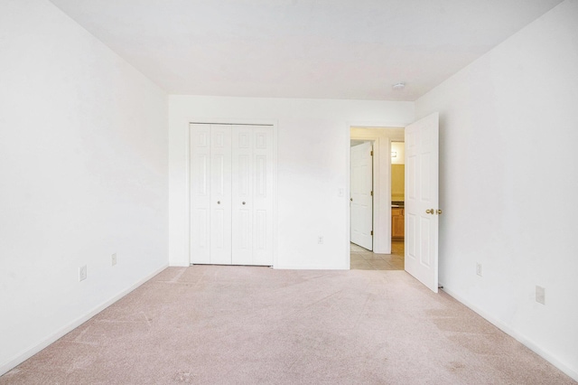 3132 Primrose Ln, Ypsilanti, MI 48197 - unfurnished bedroom with light carpet and a closet