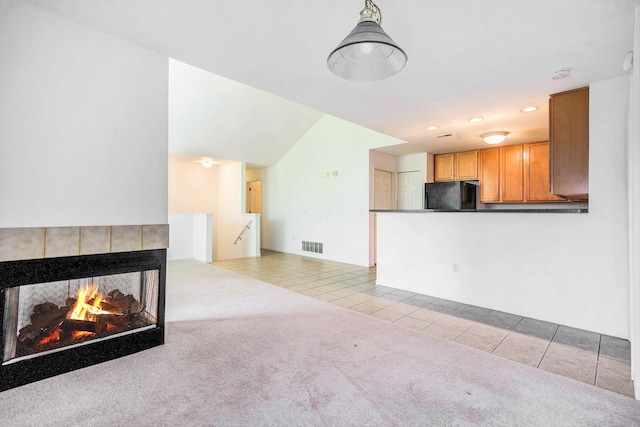 3132 Primrose Ln, Ypsilanti, MI 48197 - unfurnished living room featuring tile patterned flooring, carpet, recessed lighting, and a tiled fireplace