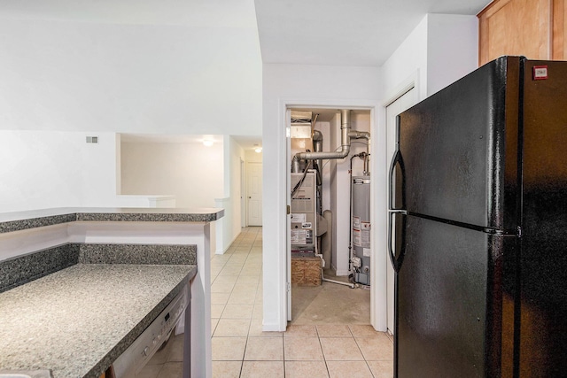3132 Primrose Ln, Ypsilanti, MI 48197 - kitchen with black appliances, light tile patterned floors, and water heater