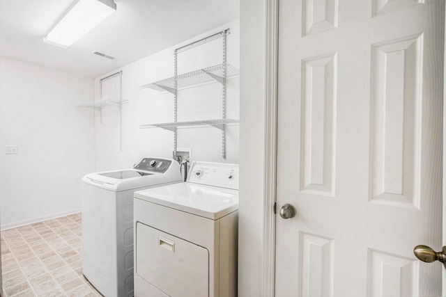 3132 Primrose Ln, Ypsilanti, MI 48197 - laundry room with independent washer and dryer and baseboards