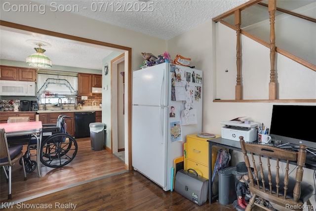4313 S Dearborn St, Melvindale, MI 48122 - kitchen featuring white appliances, a textured ceiling, dark wood-style flooring, light countertops, and brown cabinetry