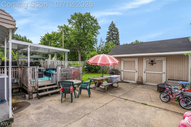 4313 S Dearborn St, Melvindale, MI 48122 - view of patio featuring a storage shed, a wooden deck, and outdoor dining area