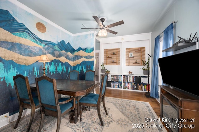 122 Dwight Ave SE, Grand Rapids, MI 49506 - dining area with wood finished floors, a ceiling fan, and ornamental molding