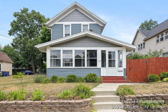 122 Dwight Ave SE, Grand Rapids, MI 49506 - traditional style home featuring a sunroom and entry steps