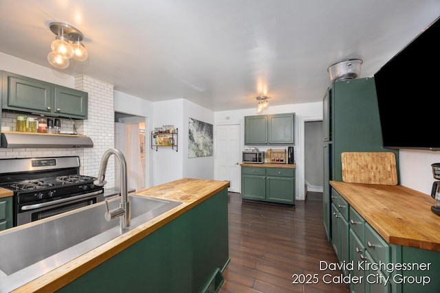 122 Dwight Ave SE, Grand Rapids, MI 49506 - kitchen featuring wooden counters, green cabinetry, stainless steel appliances, dark wood-style flooring, and under cabinet range hood